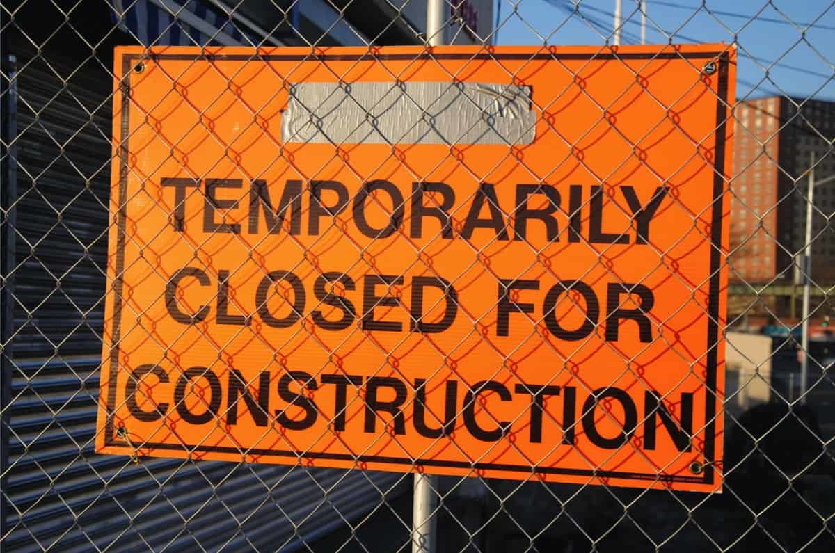 Site closed sign in orange and black
